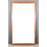 A Wood Framed Rectangular Wall Mirror, with moulded frame, inset with plain mirror plate on plinth
