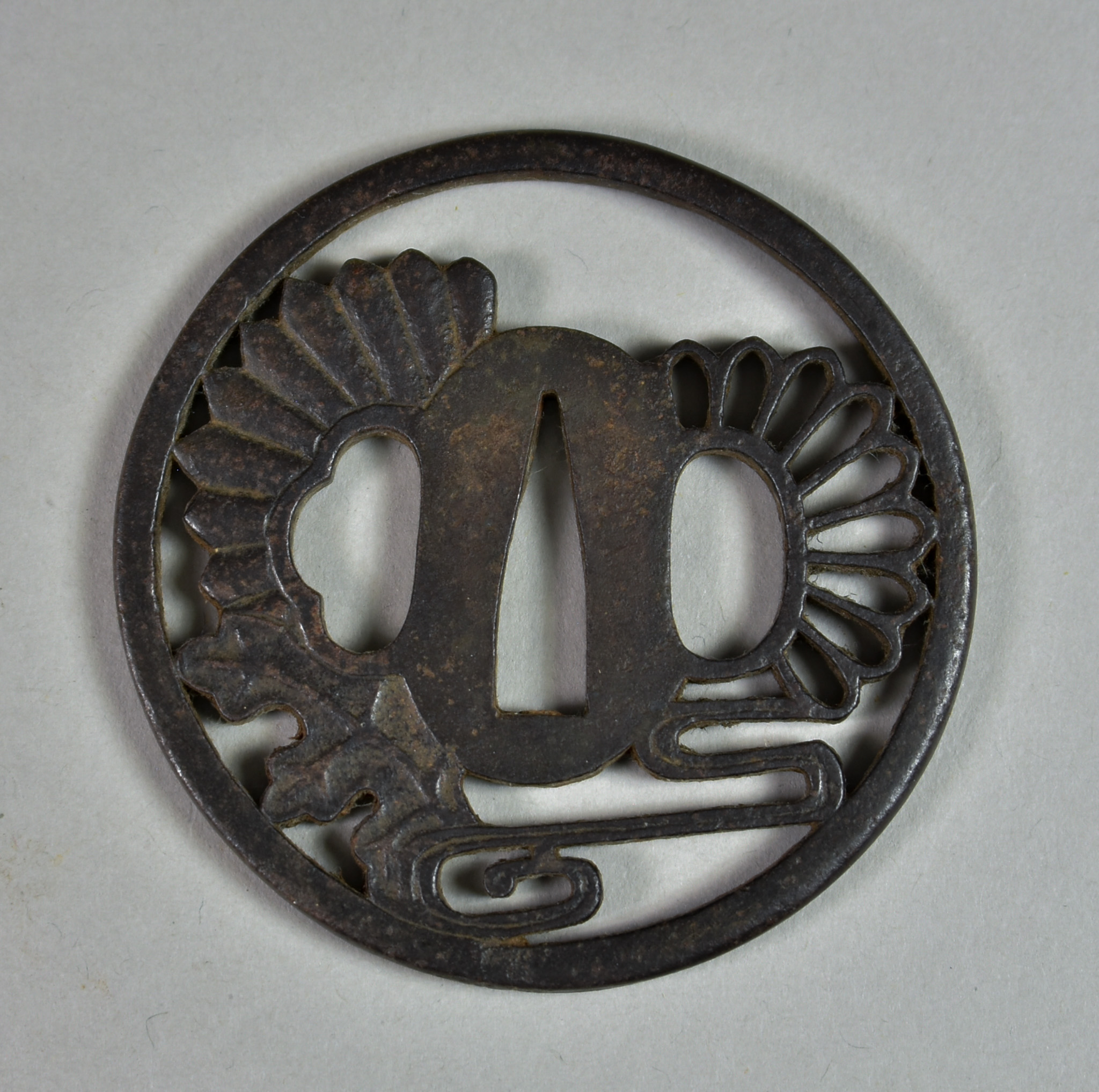 A Japanese Tsuba, iron Maru-gata depicting chrysanthemum and stream, Edo period (1615-1868), 3ins - Image 2 of 2