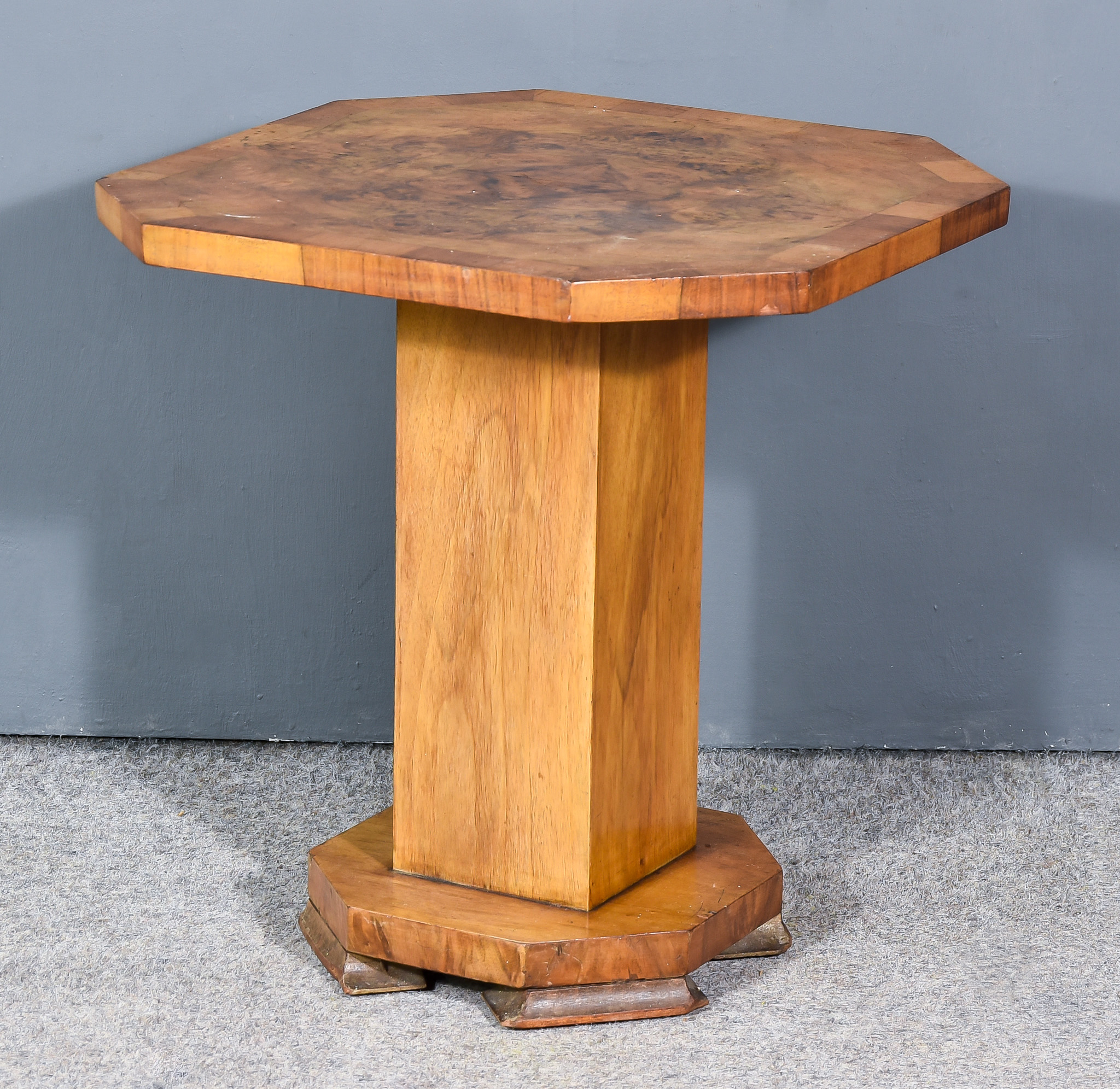 A 1930's Figured Walnut Octagonal Occasional Table of "Art Deco" Design, the top quarter veneered