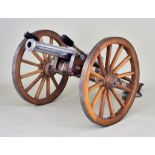 A Good Replica Field Gun, 20th Century, 14ins plated barrel, 12ins diameter wheels, 29ins overall,