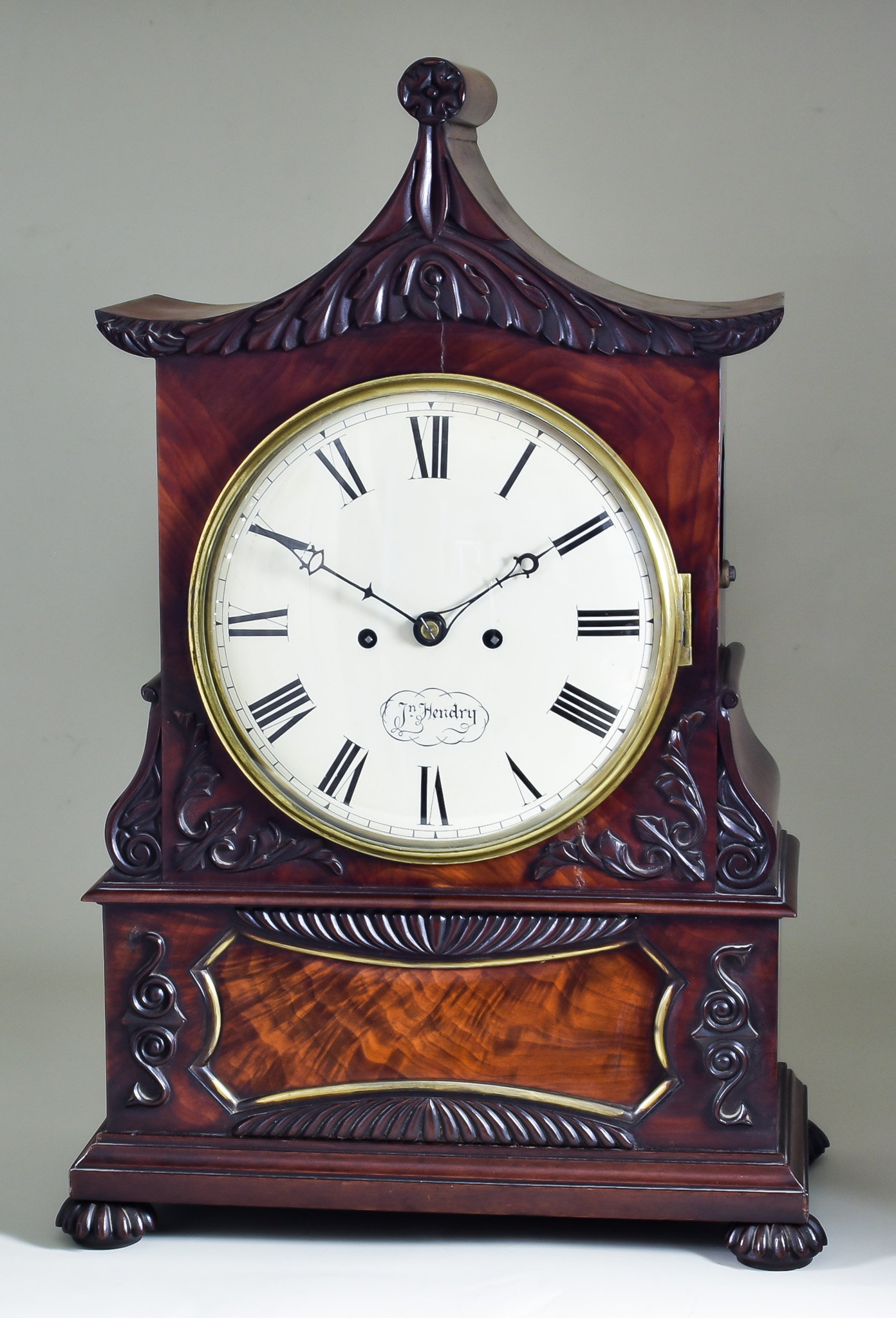 An Early 19th Century Mahogany Cased Mantel Clock, by John Hendry, the 8ins diameter cream dial with