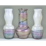 A Pair of Mother of Pearl Iridescent Glass Vases, the bulbous bases with multicoloured iridescent