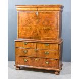 An 18th Century Walnut Secretaire Abattant, with moulded cornice and cushion fronted frieze, the
