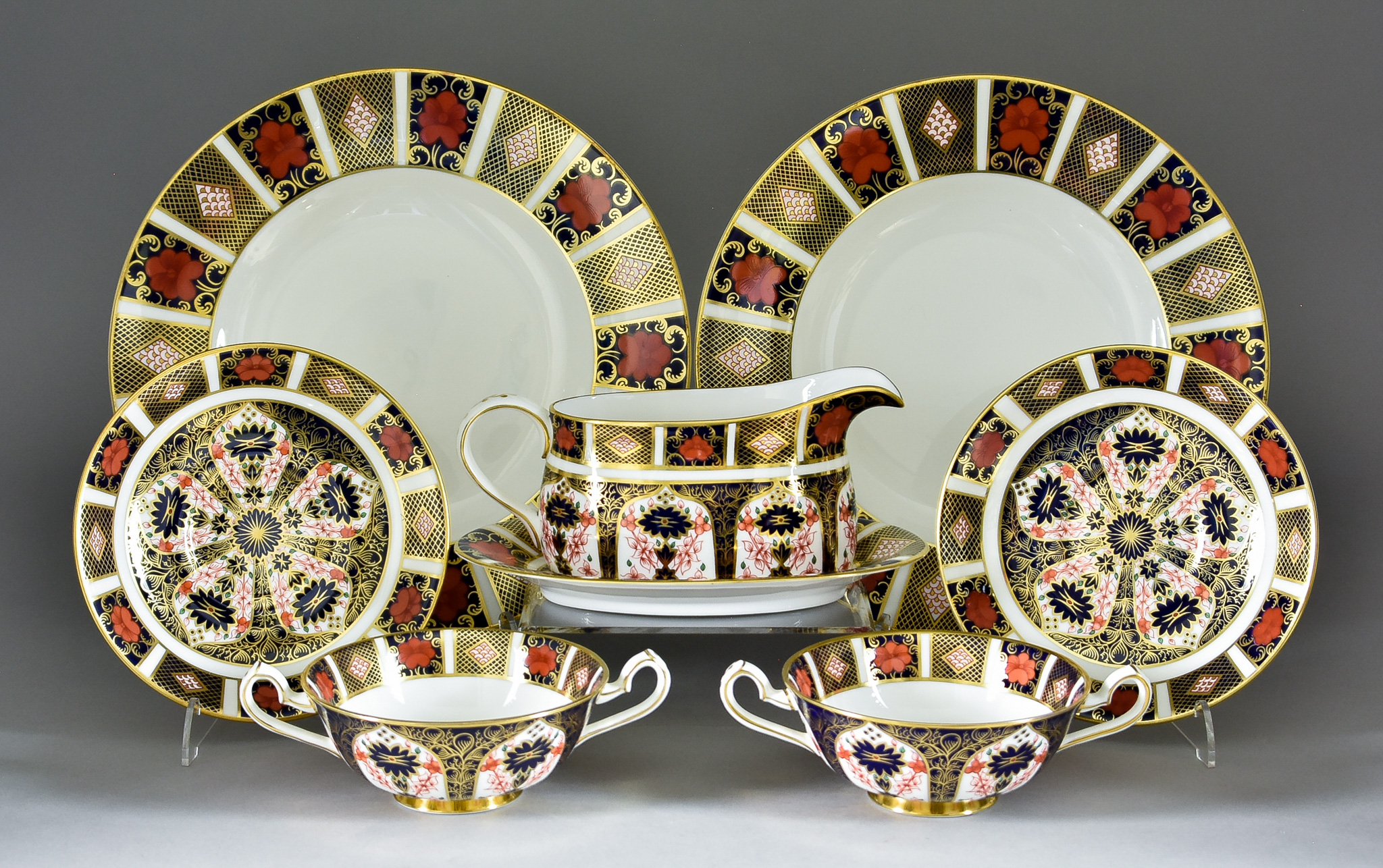 A Royal Crown Derby Bone China "Imari" Pattern Matched Dinner Service, 20th Century, for ten place