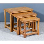A Nest of Three Robert "Mouseman" Thompson of Kilburn Tables (1896-1955), on chamfered supports, a