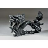 A Carved Obsidian Five-Toed Dragon, 20th Century, 11ins (27.94cm) x 6ins (15.24cm) high