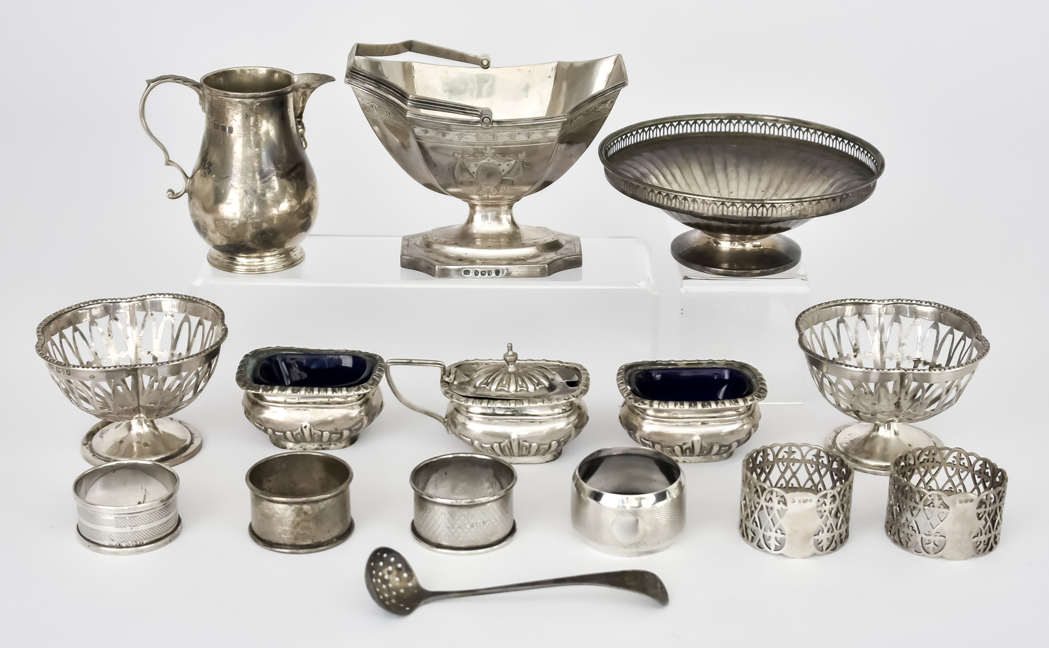 A George III Silver Oval Sugar Basket and Mixed Silver Ware, the basket maker's mark indistinct,