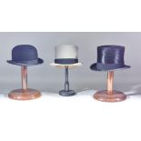 A Selection of Hats, comprising - black top hat by Christys' of London, green felt hat by Herbert