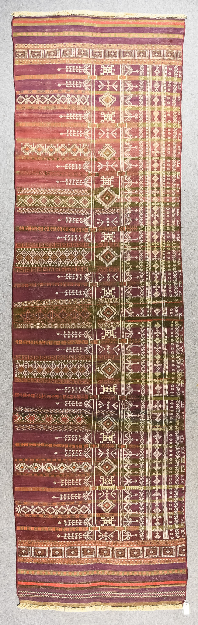 An Early 20th Century Qashqai Kelim, woven in colours, the field filled with stylised geometric