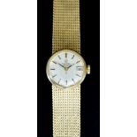 A 9ct Gold Lady's Automatic Wristwatch, by Omega, 9ct gold case, 20mm diameter, silvered dial with