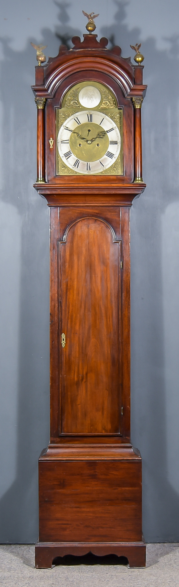 A 19th Century Mahogany Long Case Clock, the 12ins arched brass dial with silvered chapter ring with