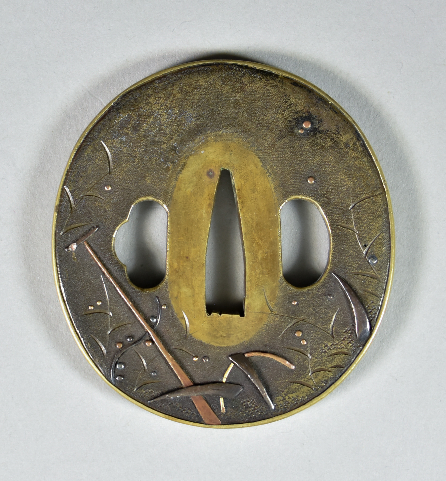 A Japanese Tsuba, Sentoku Naga Maru-gata, depicting a boat amongst reeds under a crescent moon, - Image 2 of 2