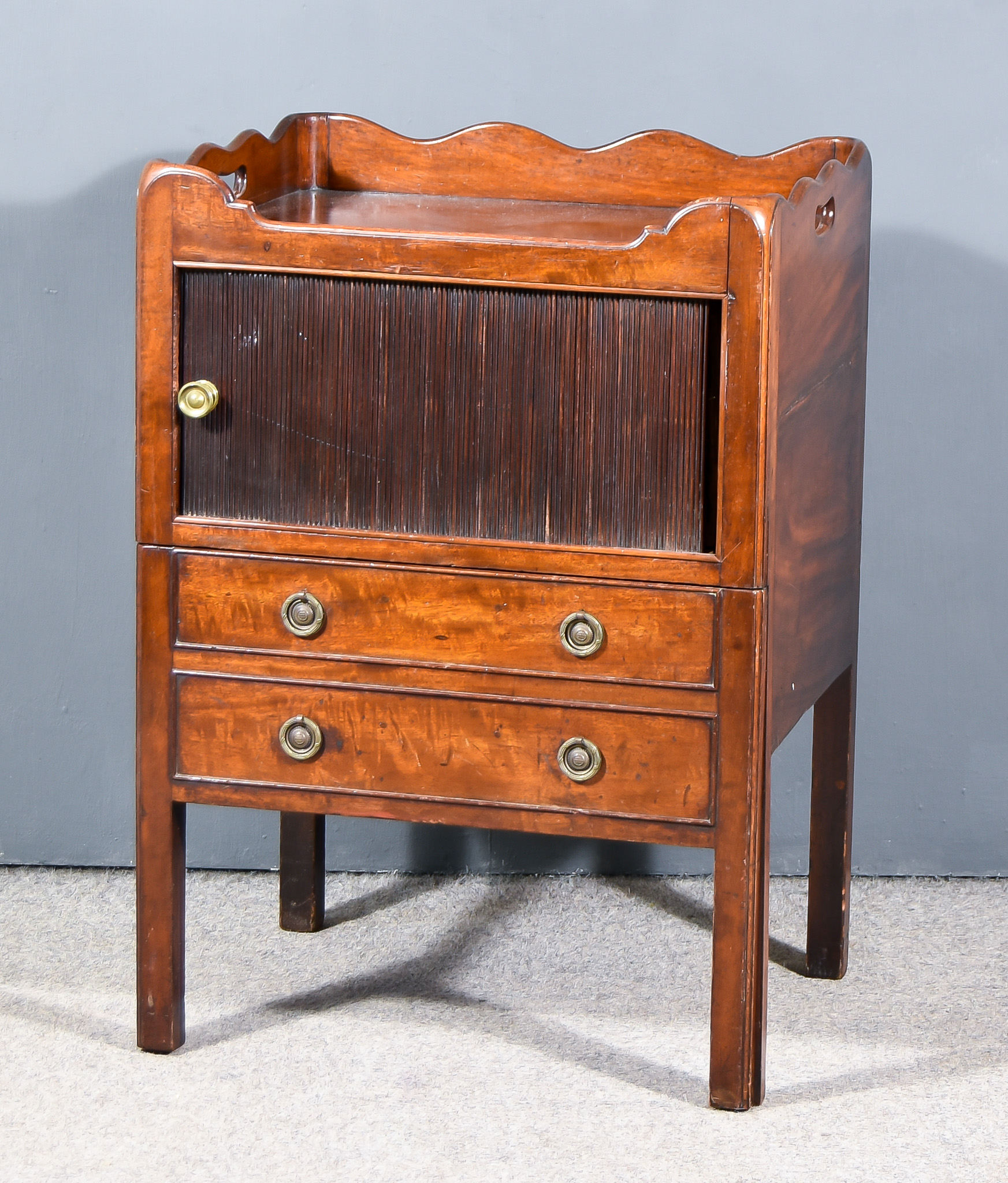 A George III Mahogany Tray Top Night Commode, with handle cut-outs to shaped top, enclosed by