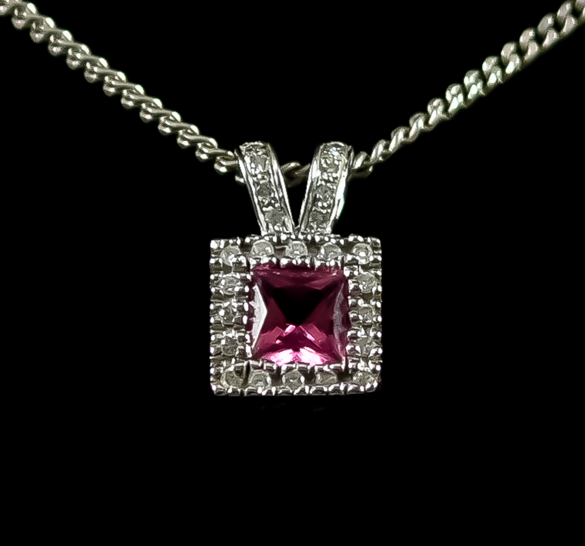 An 18ct White Gold Pink Tourmaline Pendant and Chain, Modern, set with a centre faceted pink