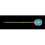 A Stick Pin, Late 19th/Early 20th Century, yellow metal set with a centre cabochon turquoise stone