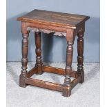 An Old Oak Rectangular Joint Stool, with shaped and moulded aprons, on baluster turned supports,