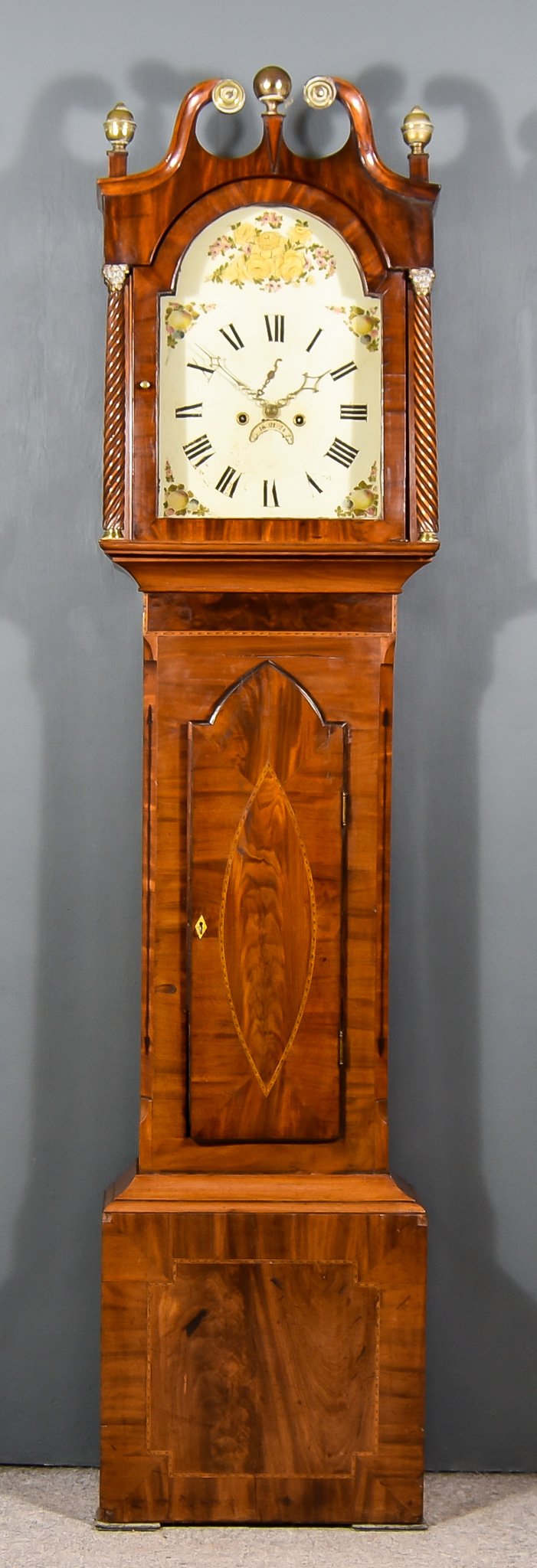 A 19th Century Mahogany Long Case Clock, the 13ins arched painted dial with Roman numerals,