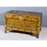 A Chinese Panelled Camphor Wood Chest, the whole boldly carved with junks within floral borders