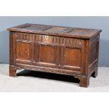 An Early 18th Century Panelled Oak Coffer, with triple fielded panel to top and front, arcaded