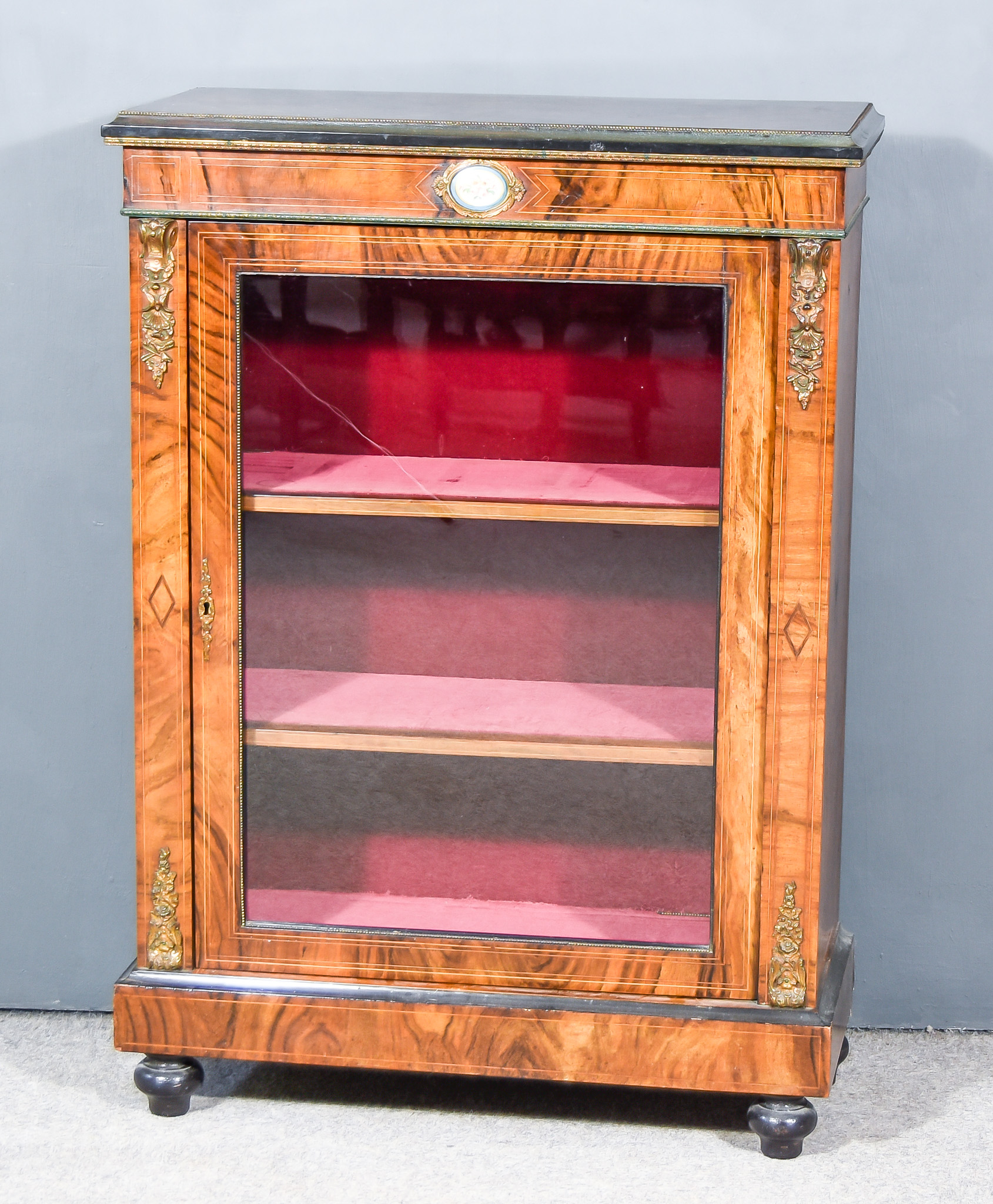 A Victorian Figured Walnut and Gilt Metal Mounted Dwarf Display Cabinet, with ebonised moulded