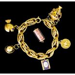 An 18ct Gold Charm Bracelet, suspended with five large charms, 220mm, gross weight 58.6g, with one