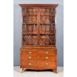 A 19th Century Mahogany Bookcase, the upper part with moulded dentil cornice, fitted three shelves