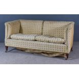 An Edwardian Square Back Two Seat Settee, upholstered in cream patterned cloth, on square tapered
