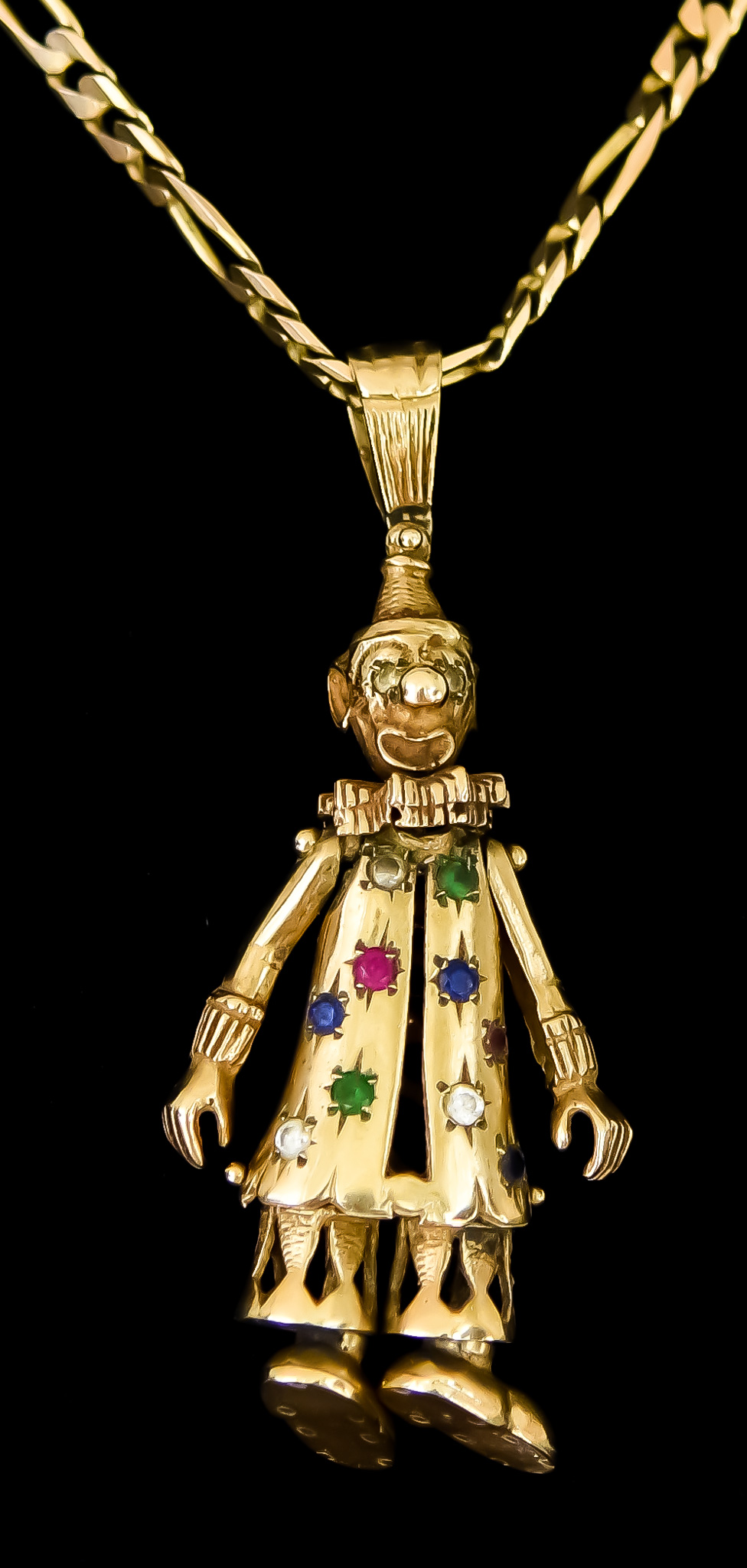 A 9ct Gold Pendant and Chain, Modern, depicting an articulated gem set clown, 70mm x 32mm, suspended