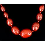 A String of Graduated Red Amber Beads, 700mm, gross weight 46.7g