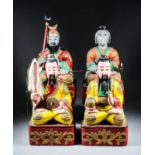 A Pair of Chinese Carved Polychrome Seated Figures of Bearded Daoist Gods, their yellow robes