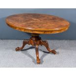 A Victorian Walnut Oval Breakfast Table, the quarter veneered figured top with later inlaid oval