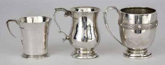 A George V Silver Baluster-Shaped Christening Mug and Two Others, the George V mug by Barker Bros,