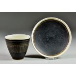 Lucie Rie (1902-1995) - Stoneware coffee cup and saucer, with oatmeal, manganese glaze, decorated