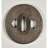 A Japanese Iron Tsuba, Naga Maru-gata depicting a nanko ground, Edo period (1615-1868), 3ins