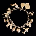 A 9ct Gold Charm Bracelet, 20th Century, with thirteen charms, approximately 160mm, total gross