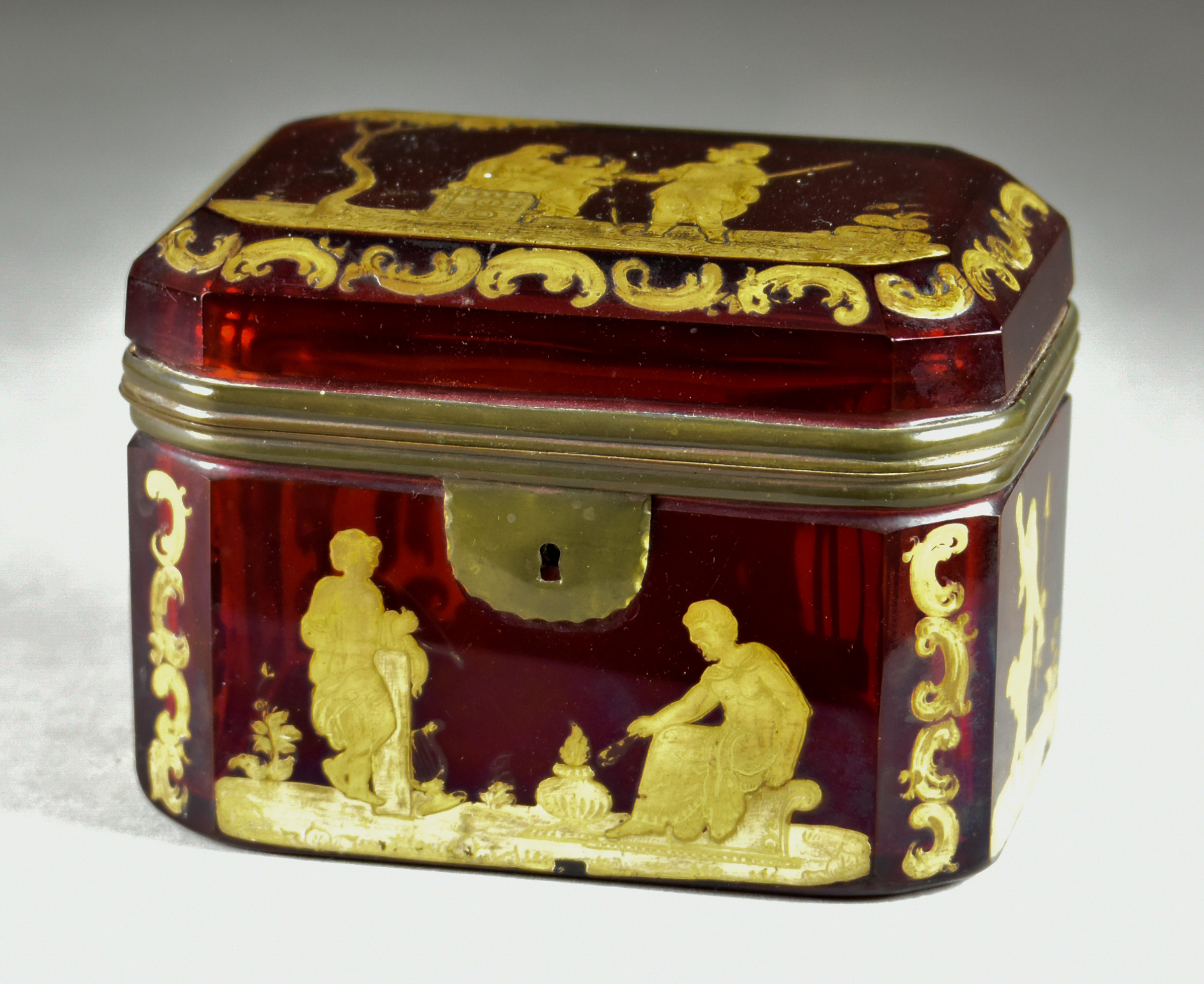 A Ruby Glass and Gilt Metal Mounted Rectangular Casket, 19th Century, with cant corners, decorated