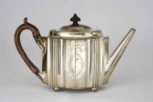 A George III Silver Oval Teapot, possibly by Thomas Oliphant, London 1789, of shaped outline,