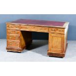 A Victorian Mahogany Partners Desk, with moulded edge to top, inset with red and gilt leather, three