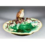A George Jones Majolica Strawberry Dish, 1869, enamelled in colours and modelled with a thrush,