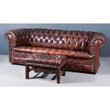 A 20th Century Chesterfield Settee upholstered in brown leather, buttoned and studded 81ins wide x