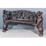A 20th Century Black Forest Carved Wood Bear Bench the arch back carved with bear to centre,