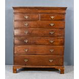 A Late Georgian Oak Chest, with moulded edge to top, inlaid frieze, fitted two short and five long