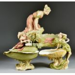 A Royal Dux Porcelain Centrepiece, modelled as a young woman kneeling on a rock, model no. 598,