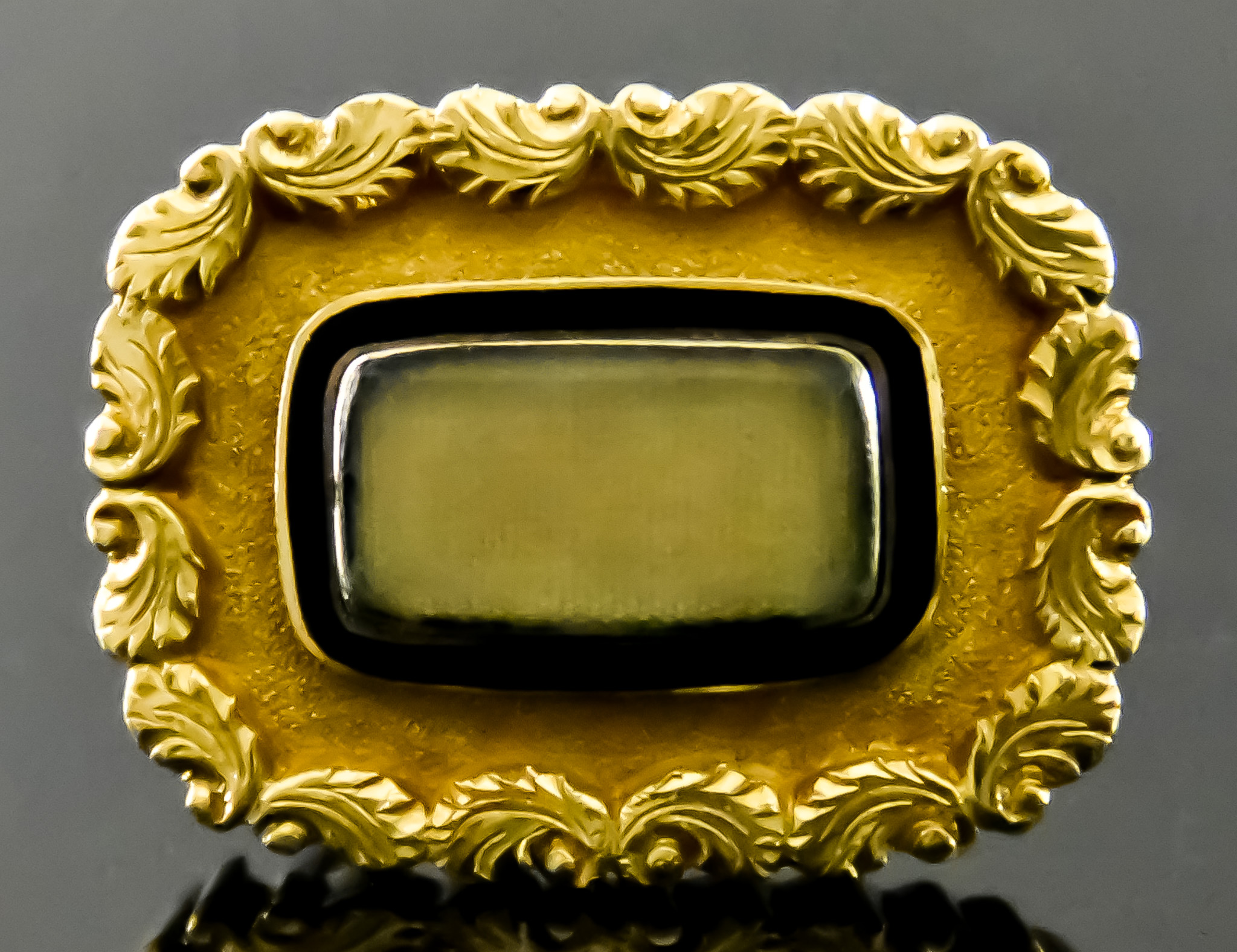 A Yellow Metal Memento Mori Brooch, 19th Century, glazed panel to front with black enamelled border,