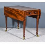 A Victorian Mahogany Pembroke Table, fitted one real and one dummy drawer, on turned legs and