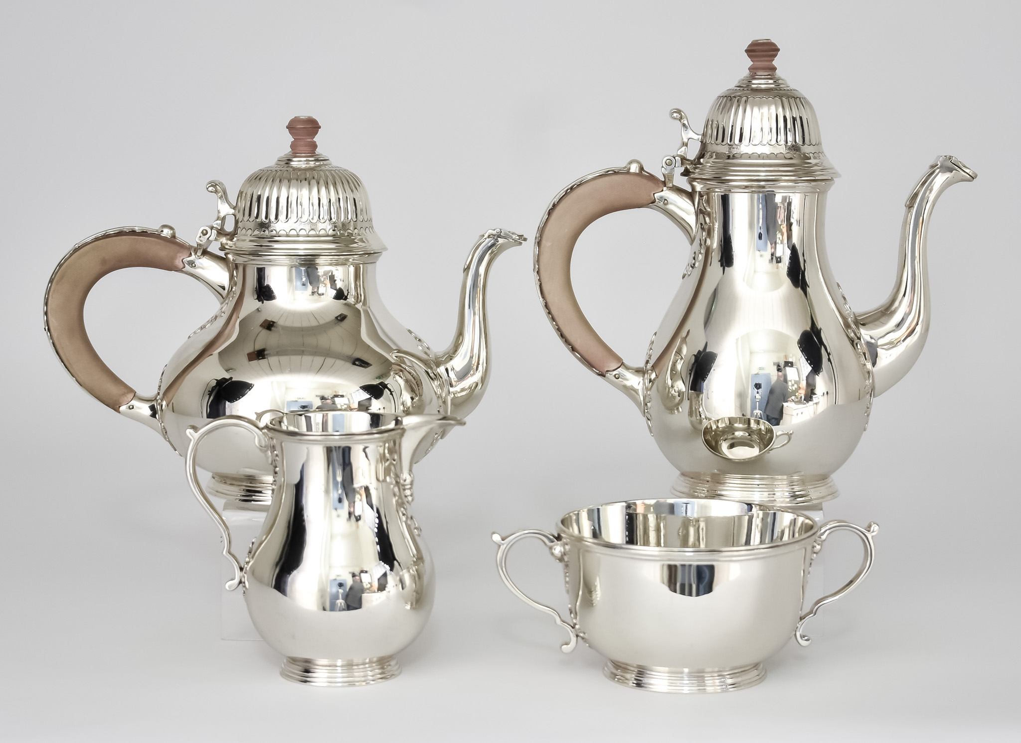 An Elizabeth II Silver Four Piece Tea and Coffee Service, by William Comyns, London 1950 and 1954,
