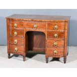 A George IV Bow Fronted Figured Mahogany Dressing Table, with square edge to top, fitted nine