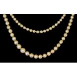 A Double String of Cultured Pearls, with diamond set clasp, two rows of cultured pearls 500mm,