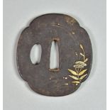 A Japanese Iron Tsuba, Egurikomi, Mokko-gata depicting flowers and dew drops, 2.5ins diameter, and