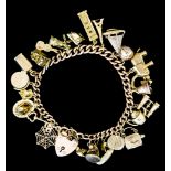 A 9ct Gold Charm Bracelet, suspended with twenty four charms, 220mm, total gross weight 59.7g
